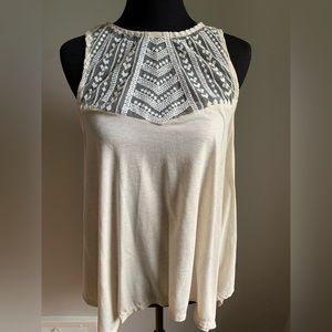 Poof ivory sleeveless blouse